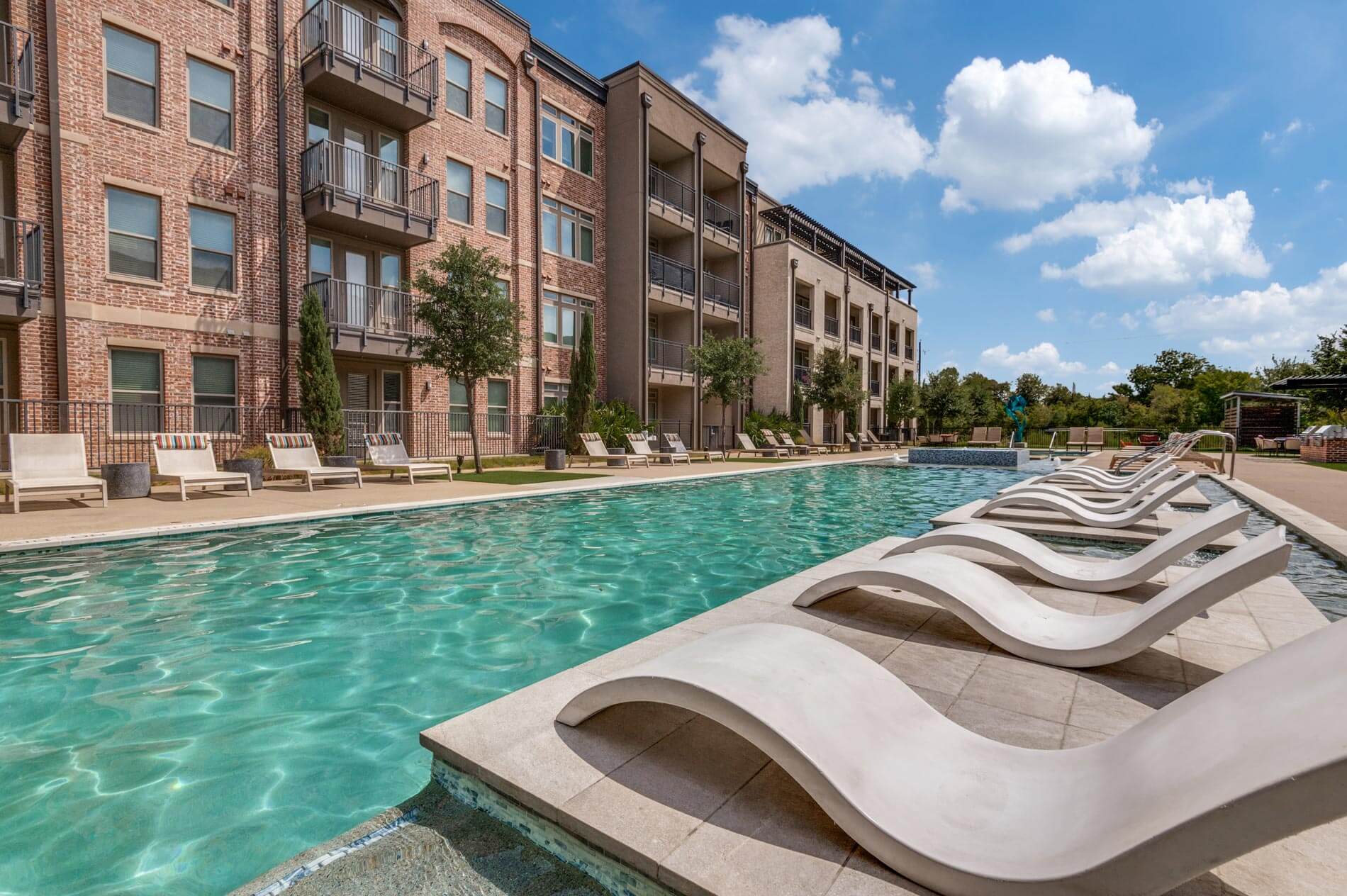 Pool area with lounge chairs