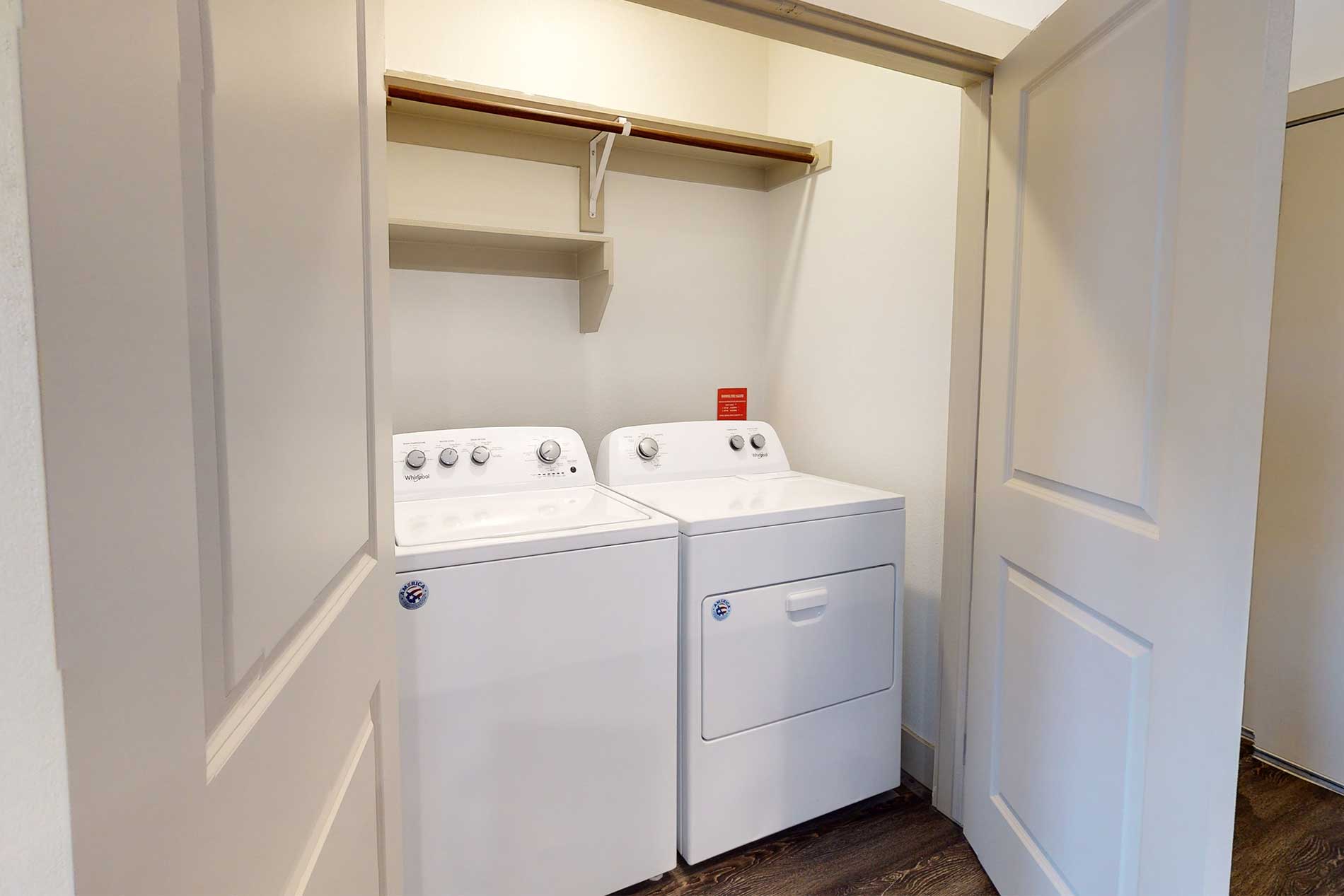 Laundry area with full sized washer and dryer.